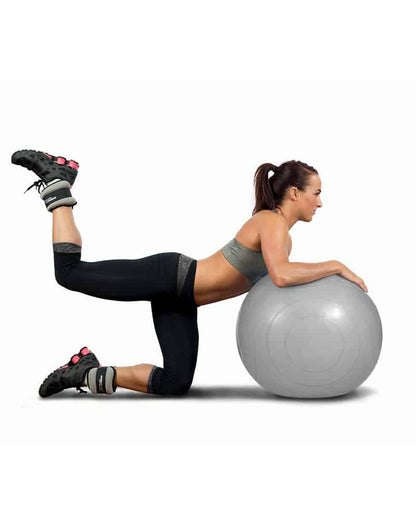 woman with stability ball and ankle weights