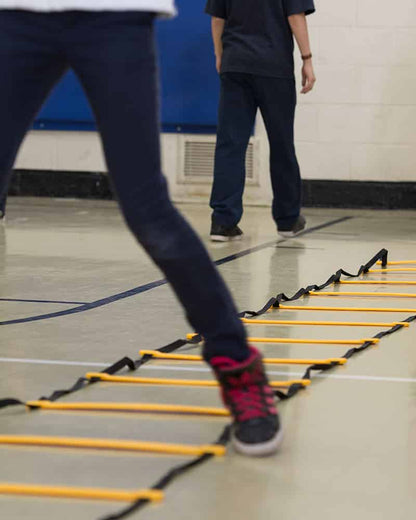 Close up of child using agility ladder