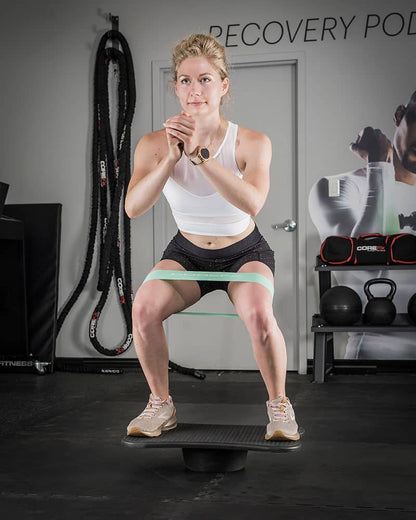 COREFX Wobble Board girl squatting