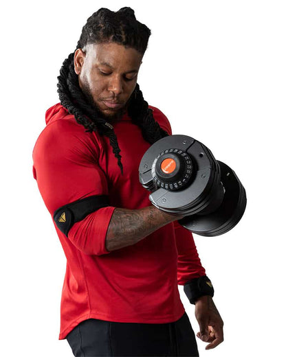 Man doing bicep curl with Adjustable Dumbbell Set