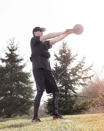 Man doing kettlebell swing workout