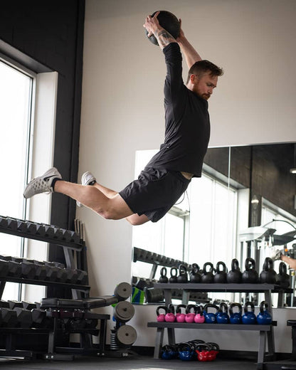 Male jumping with COREFX Slam Ball