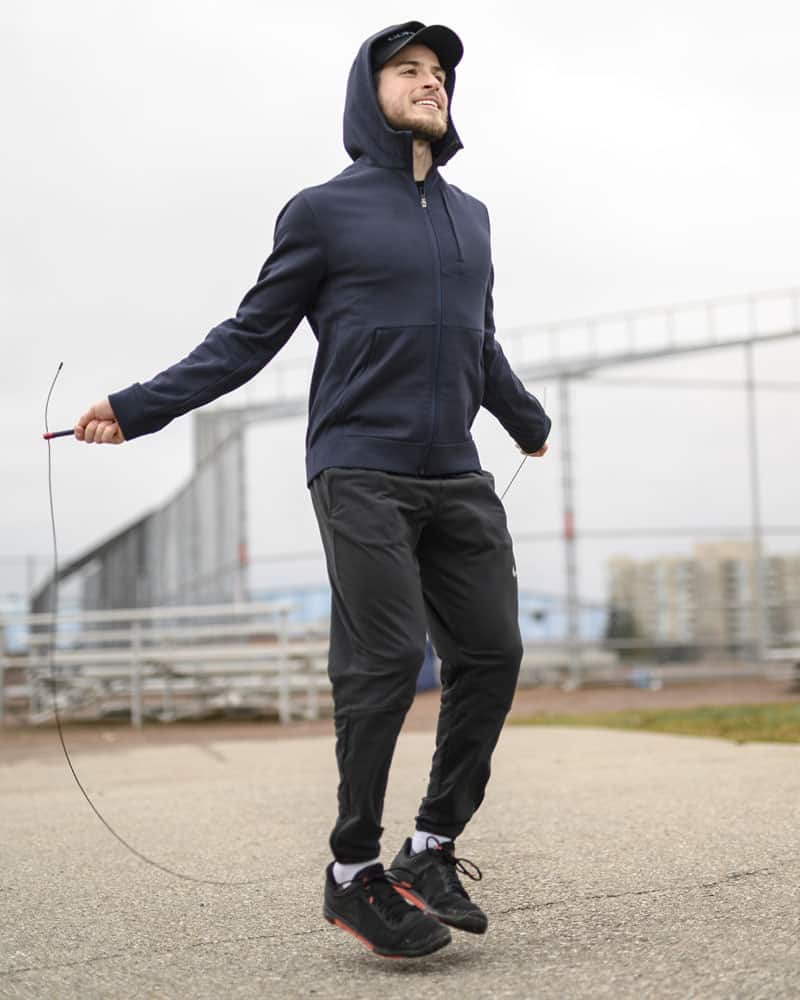 COREFX Thin Grip Speed Rope male jumping outside