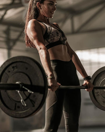 female deadlifting the Concorde training barbell