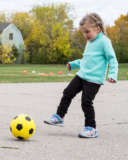 Girl Kicking Sponge Rubber Soccer Ball