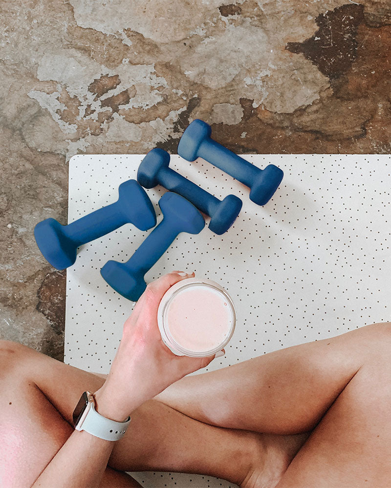 Lifestyle photo of dumbbells and smoothie