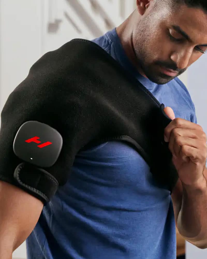Male athlete adjusting strap for Venom 2 Shoulder