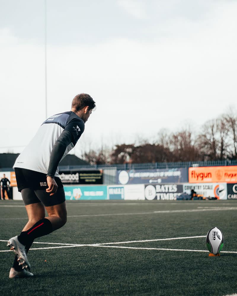 Rugby Player approaching ball on tee