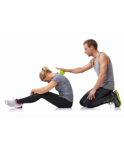 Man massaging woman's back with the Concorde Massage Ball