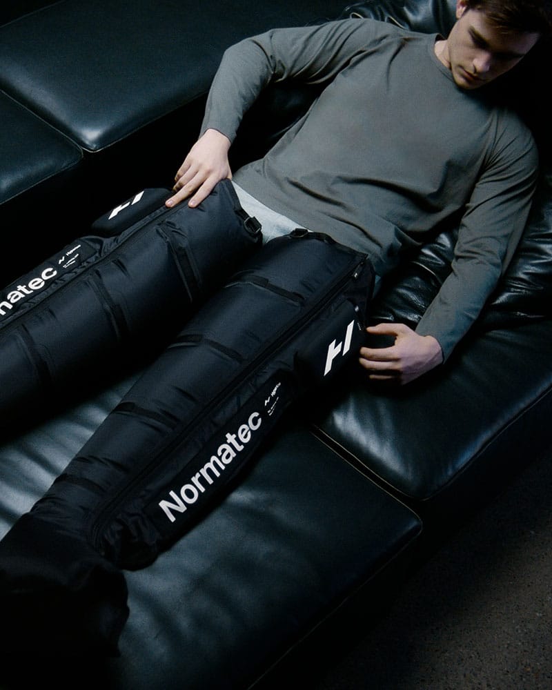 Male using Normatec Elite for Leg Recovery