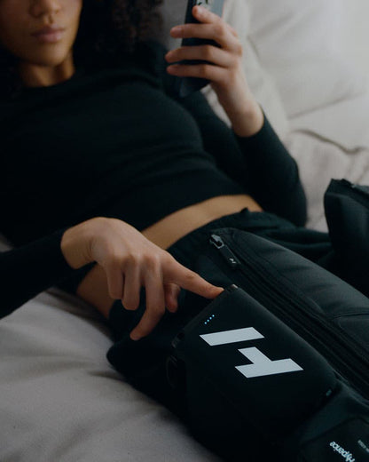 Woman adjusting Normatec Elite