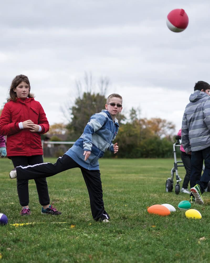 Little Boy Throwing Mini Coated Foam Football