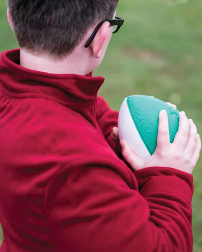 Boy using Mini Coated Foam Footballs