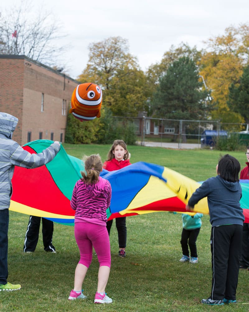 multi-coloured parachute on playground