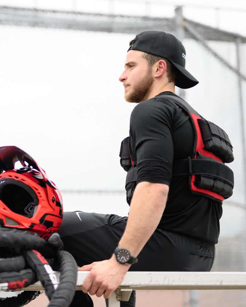 man sitting wearing weighted vest