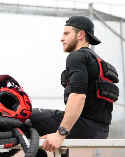 man sitting wearing weighted vest