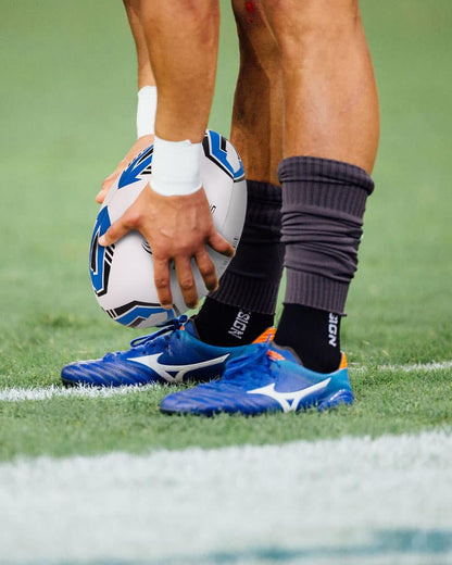 Rugby player holding match ball