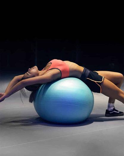 Woman stretching on stability ball