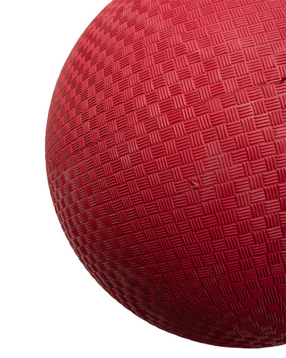 Close-up texture of red rubber playground ball