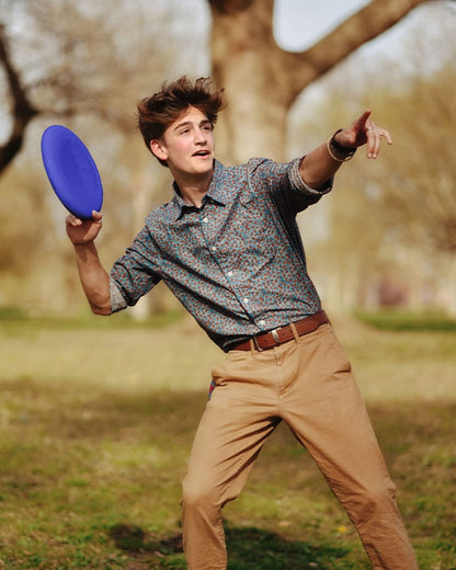 Boy throwing blue frisbee disc from Sports Kit