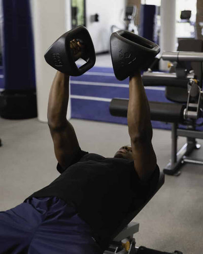 Male doing dumbbell exercises with YBell Pro