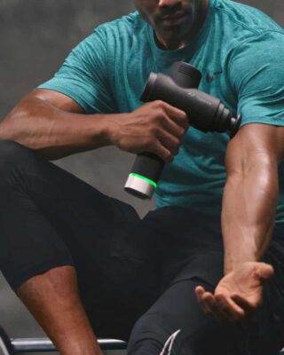 Athlete using Hypervolt 2 Pro on arm muscle recovery